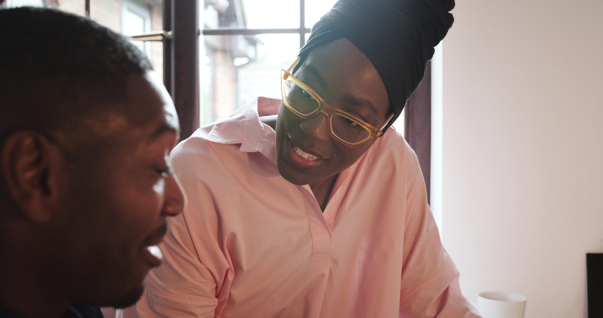 Home, conversation and black couple with communication, conversation and support in marriage, relationship or partnership. African, man and woman speaking together and planning for future in house