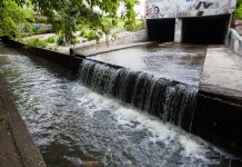 Water stream flowing out from underground tunnel