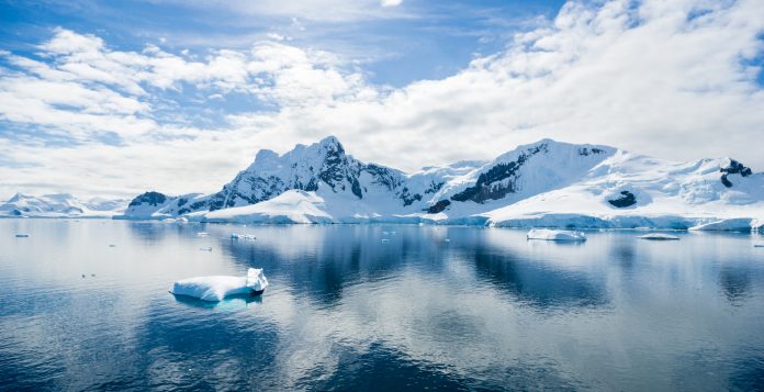 Antarctic Landscape with Icebergs and Mountains