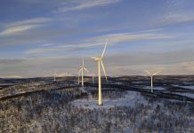 Wind power stations in a winter landscape in the Lapland province in north of Sweden above the polar circle.