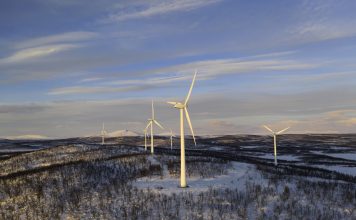 Wind power stations in a winter landscape in the Lapland province in north of Sweden above the polar circle.