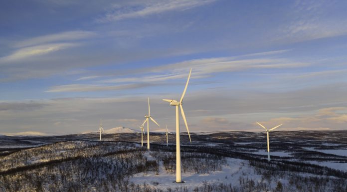 Wind power stations in a winter landscape in the Lapland province in north of Sweden above the polar circle.