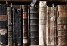 "400 year old antique books in a library. Photo was taken at avaible light, for accurate representation of the atmosphere inside."