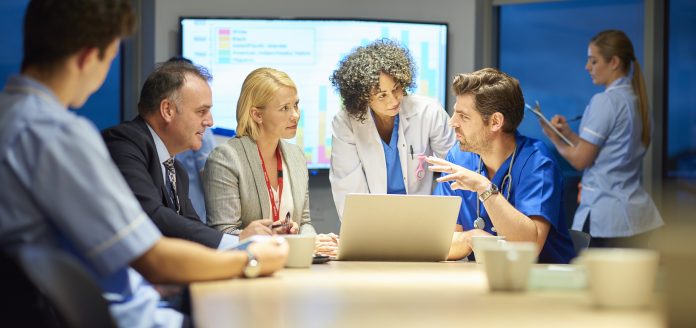 hospital management listening to doctor