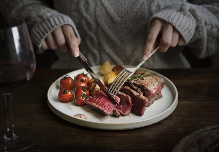 Close up of a cutting a fillet steak food photography recipe idea