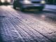 Cars on a snowy road at night