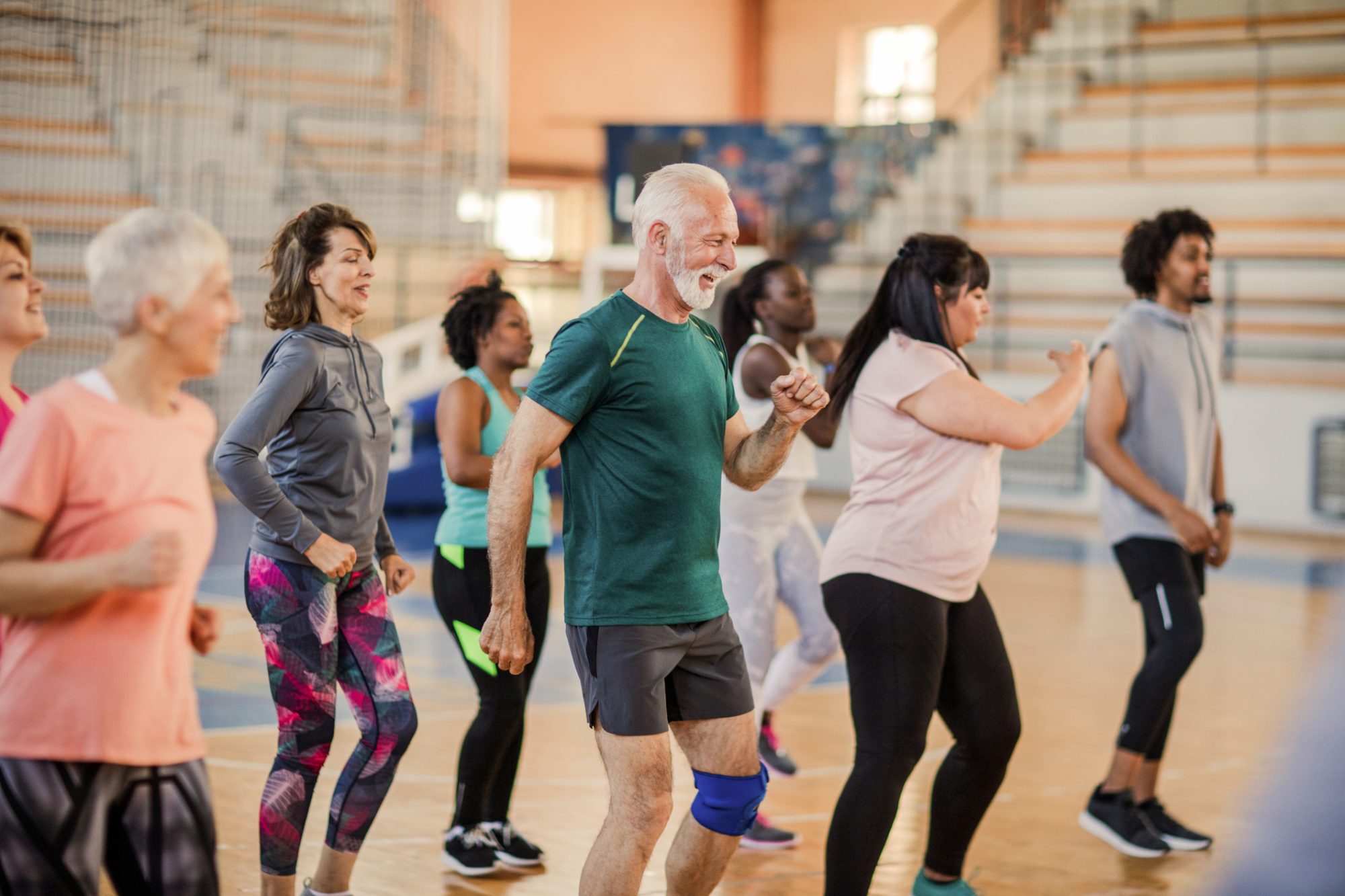 Large group of people dancing at Zumba class