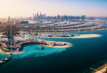 The Palm island panorama with Dubai marina in the background aerial