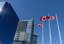 National Flags of Canada and Vancouver City skyscrapers skyline