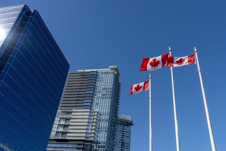 National Flags of Canada and Vancouver City skyscrapers skyline
