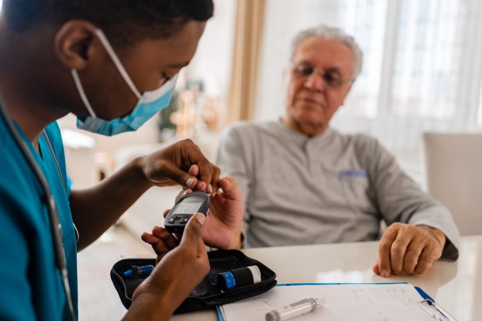 District male nurse at home visit, diabetes