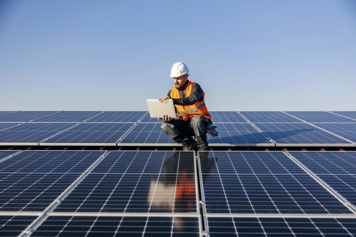 Man working on a solar panel