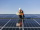 Man working on a solar panel