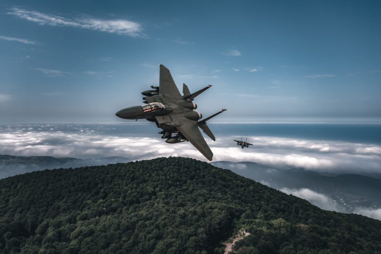 Jet fighters flying over the clouds.