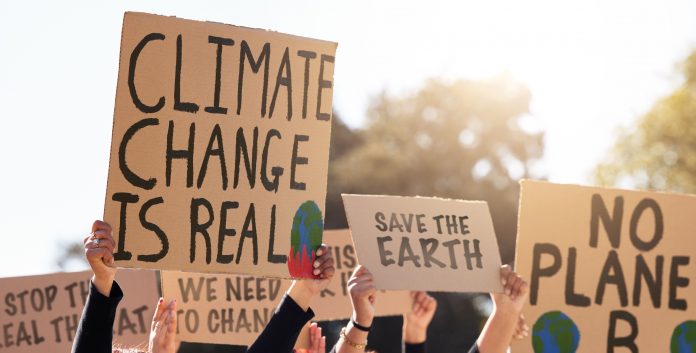 Shot of a group of people protesting climate change