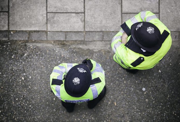 Looking down on two police officers in London