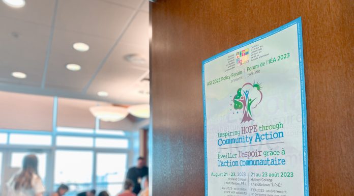 Poster on brown door into classroom