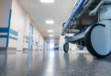 Medical bed on wheels in the hospital corridor.