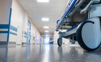 Medical bed on wheels in the hospital corridor.