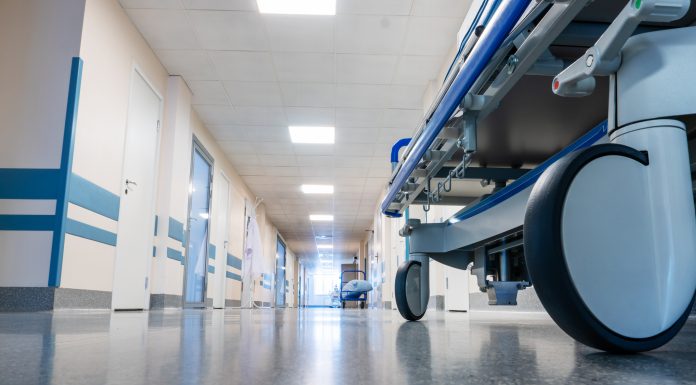 Medical bed on wheels in the hospital corridor.