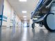 Medical bed on wheels in the hospital corridor.