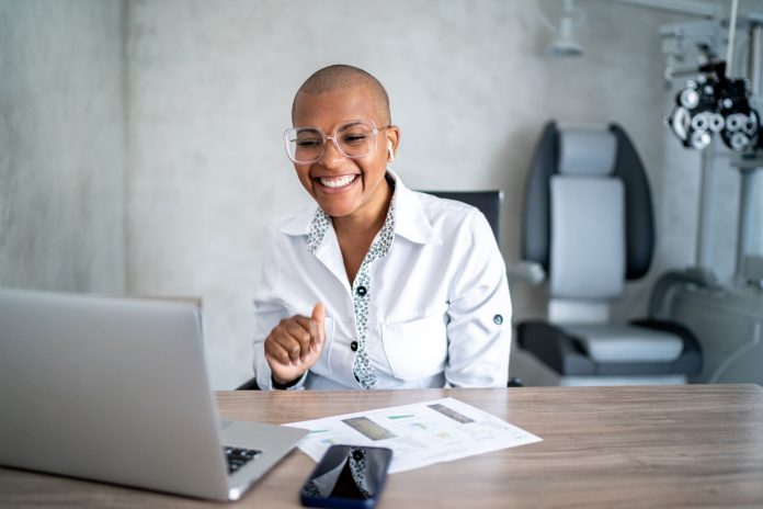 Doctor doing a video call on computer in a medical clinic