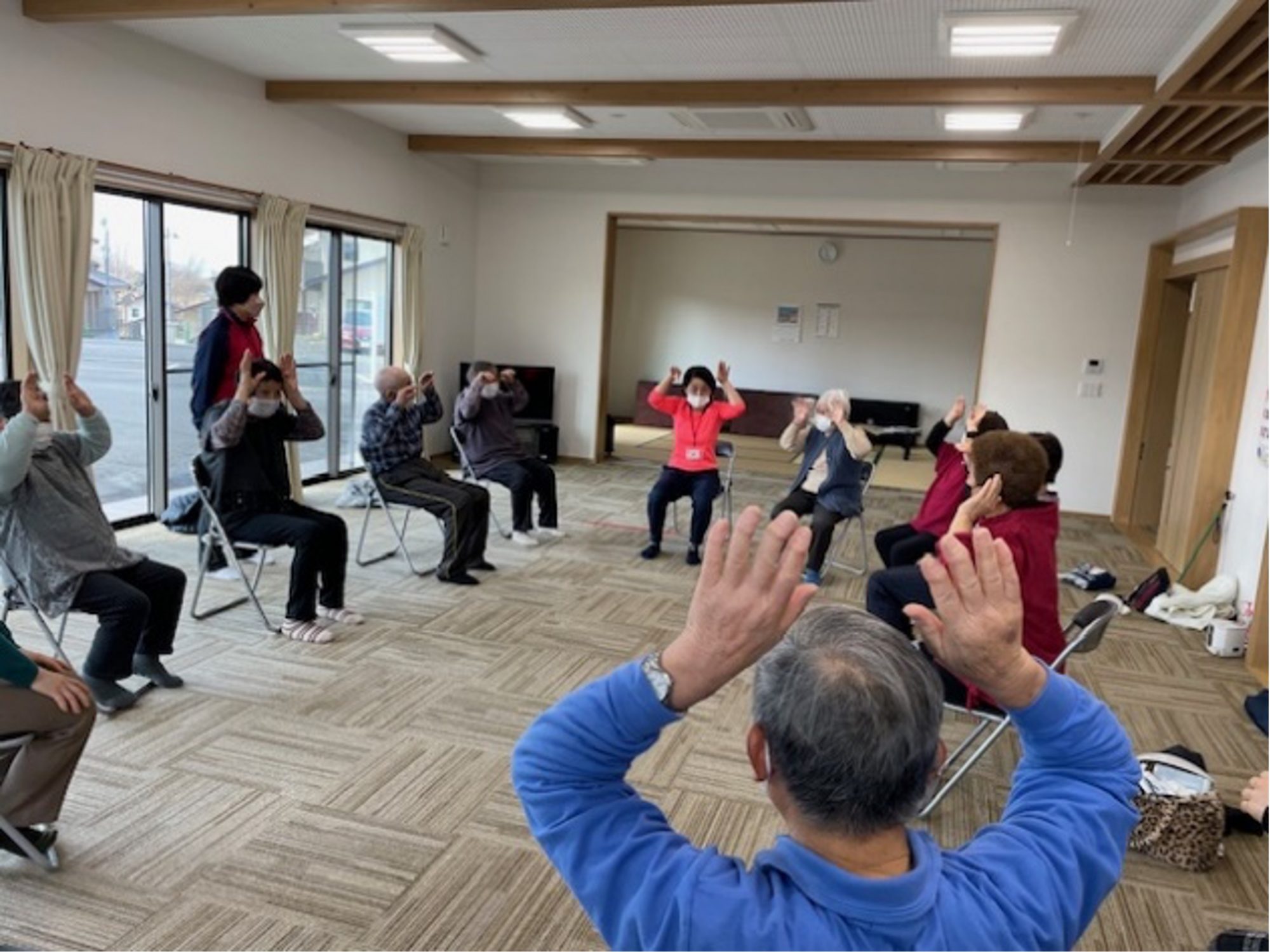 Figure 2. Older people gather in gymnastics classes. This class is held once a week at the meeting center of the reconstruction public housing in Miharu Town, where many evacuated Katsurao residents live 