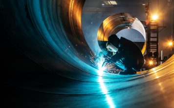 The welder is welding steel plates