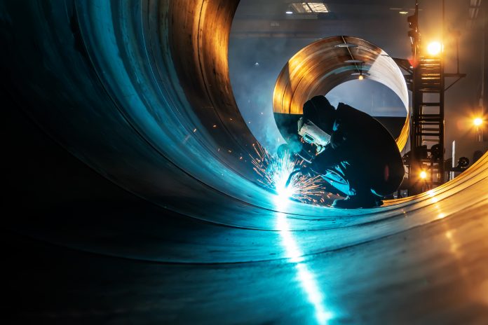 The welder is welding steel plates