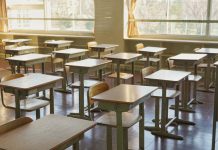 Desks and chairs in an empty classroom. This is Japanese school.