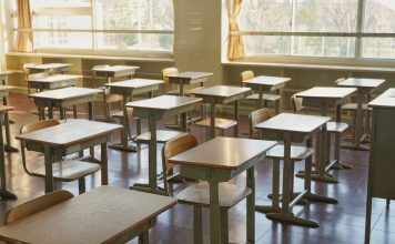 Desks and chairs in an empty classroom. This is Japanese school.