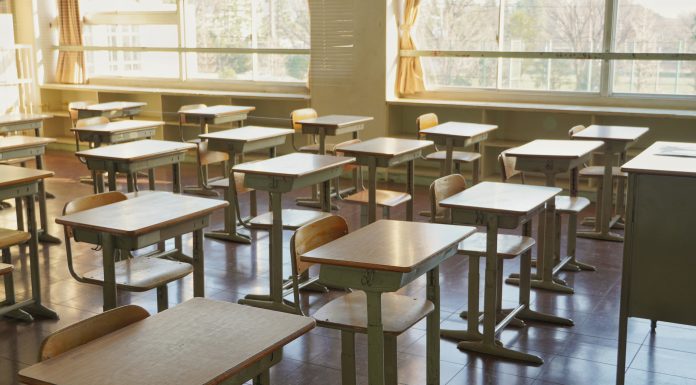 Desks and chairs in an empty classroom. This is Japanese school.