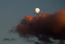 Moon in the sky and a red cloud