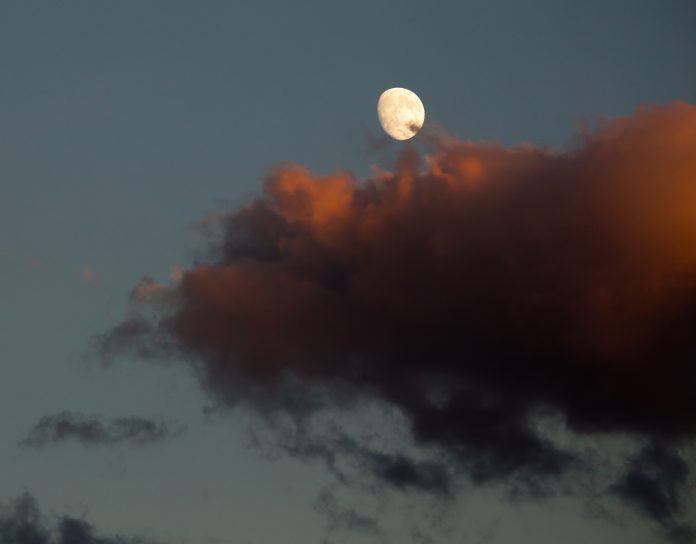 Moon in the sky and a red cloud