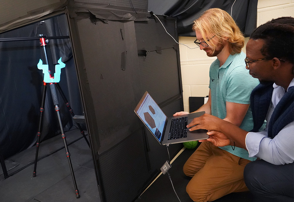 Murray-Bruce and Czajkowski using their technology to reveal what lies on the other side of the wall.