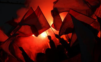 fans at sports event going crazy, symbol picture for crowd power, enthusiasm, maybe also hooligans and extremism