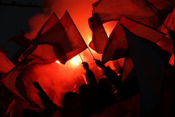 fans at sports event going crazy, symbol picture for crowd power, enthusiasm, maybe also hooligans and extremism