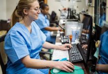 Nurses sitting in reception in hospital