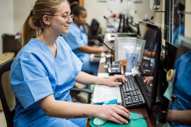 Nurses sitting in reception in hospital