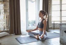 Young sporty woman practicing yoga