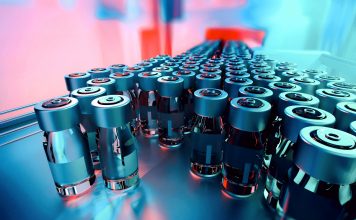 Close-up of medicine glass vials on a pharmaceutical production line, with metal caps and blank labels, moving forward. Industrial background, manufacturing equipment. Teal and orange hues. Digitally generated image. Selective focus.