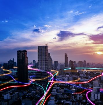 Smart city with speed line glowing light trail surround the city. big data connection technology concept, It business value