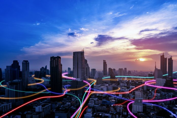Smart city with speed line glowing light trail surround the city. big data connection technology concept, It business value