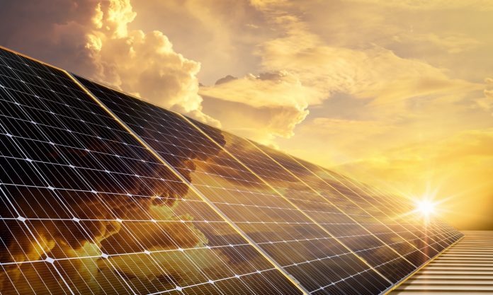 Solar panels reflect sparkling light and golden sky,Clean energy, and environment