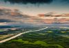 Green forest aerial view. Drone photography. Summer sky. Sustainability. Nature conservation. Morning