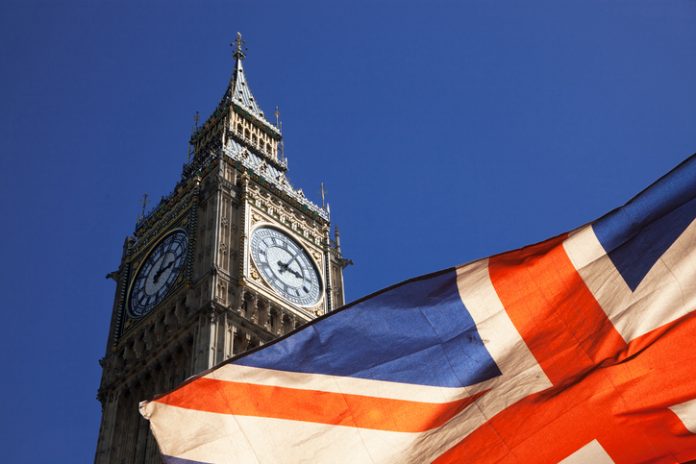 brexit concept - double exposure of flag and Westminster Palace with Big Ben