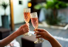 Women's hands toasting at a beauty spa