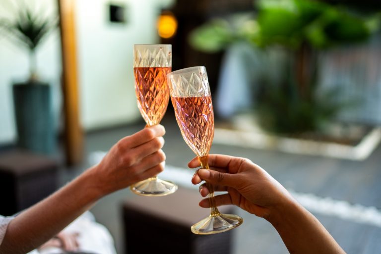 Women's hands toasting at a beauty spa