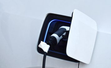 Close up or macro of a white electric car charging