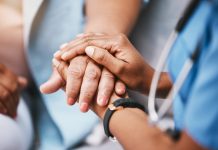 Empathy, trust and nurse holding hands with patient for help, consulting support and healthcare advice. Kindness, counseling and medical therapy in nursing home for hope, consultation and psychology.